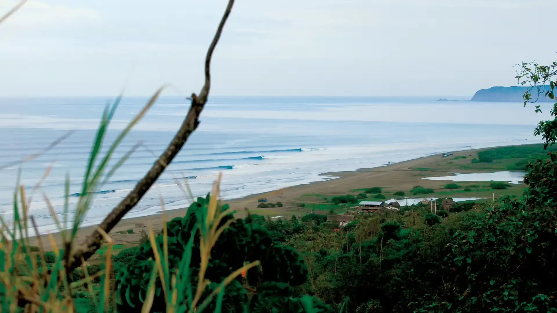 Aerial view of a long point break on Ecuador's Pacific coast