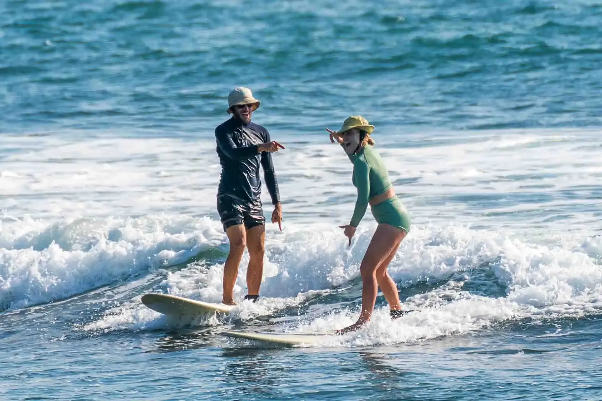 Surf guide watching and coaching a guest at a break near Montanita, Ecuador Surf Camp